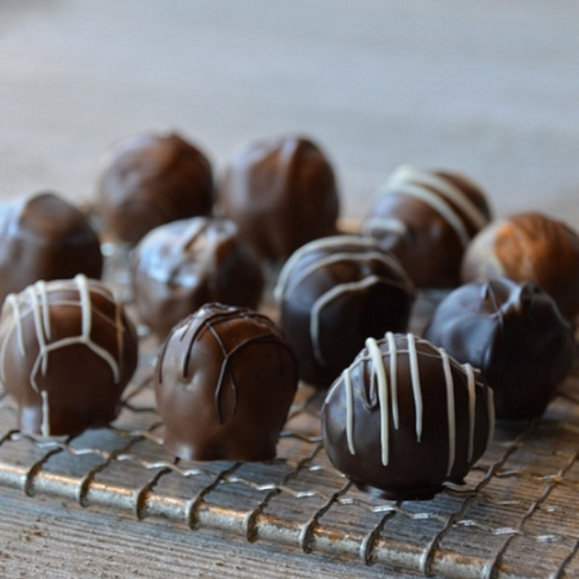 Chocolate Cover truffles with creamy filled chocolate ganache center. Assorted box contains several flavors options of Milk and Dark chocolate truffles.