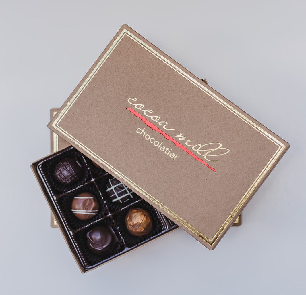 Assorted Chocolate Covered Truffles. Silky smooth chocolate ganache in assorted flavors. Box of 12.